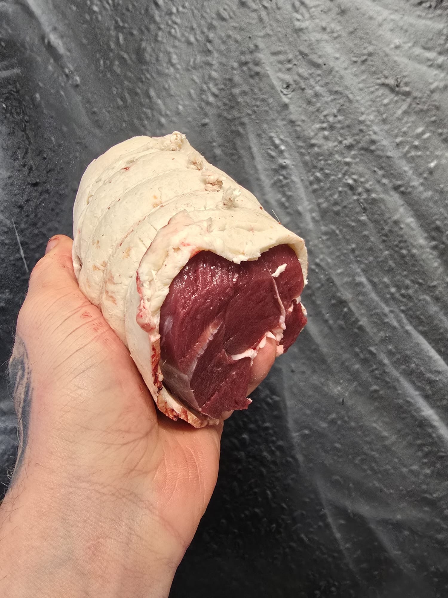 Wild Fallow Deer haunch joint wrapped in beef fat